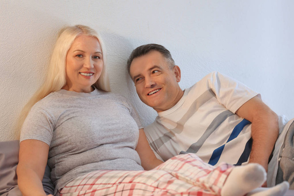 Senior couple on bed together - Fotó, kép