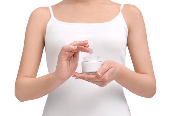 Woman holding jar with body cream on white background - Photo, image