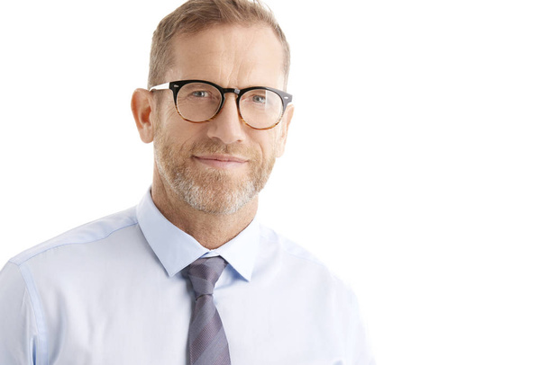 Close-up portrait of smiling middle aged businessman wearing eyewear while standing at isolated white background.  - Φωτογραφία, εικόνα