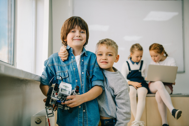 little kids with diy robot on machinery class - Photo, Image