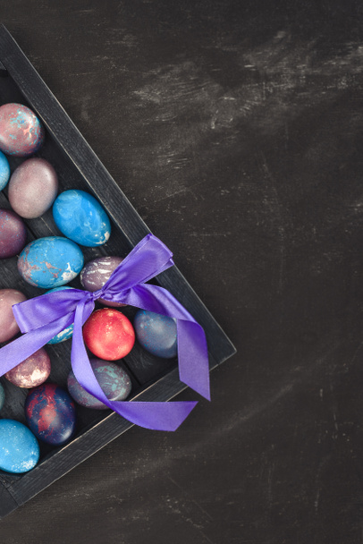top view of traditional easter eggs in gift box with bow - Zdjęcie, obraz