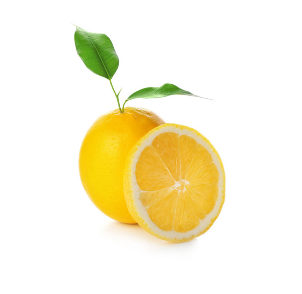 Fresh ripe lemon with leaves on white background - Valokuva, kuva