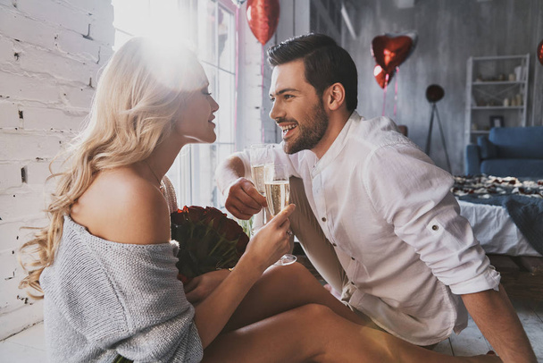 romantic happy couple in love with champagne glasses celebrating valentines day - Фото, изображение