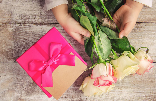 gift and flowers. selective focus. - Photo, Image