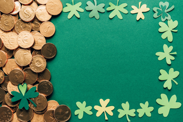 top view of shamrock and golden coins on green, st patricks day concept - Фото, изображение