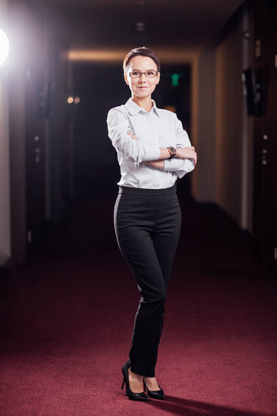 businesswoman standing in office building - Photo, Image
