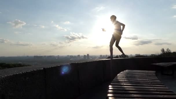 Smart man dances on an observation deck in Kyiv in slo-mo - Video