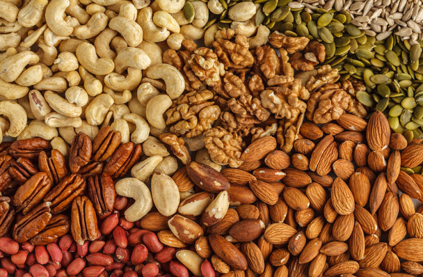 A variety of nuts and seeds background, food background, vegan h - Foto, imagen