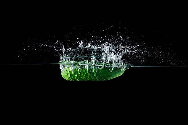 cucumber in water with splash - Фото, зображення