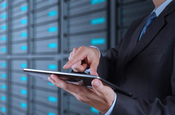 businessman using tablet computer and server room background - Photo, Image