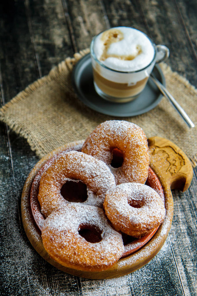 Donuts sprinkled with powdered sugar. Russian cuisine - Photo, Image