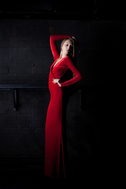 Young woman in red long dress - night club - Foto, Imagem