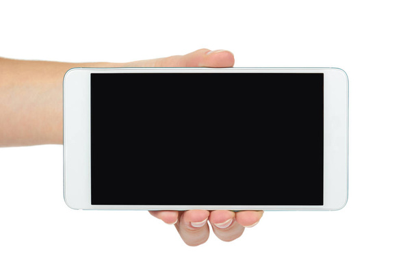 Białe telefon komórkowy z ciemny ekran w ręku, na białym tle. Reklama szablon, miejsce - Zdjęcie, obraz
