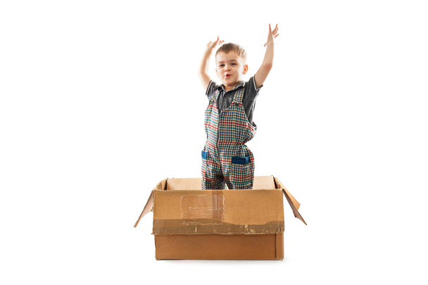 Little boy in paper box - Photo, Image