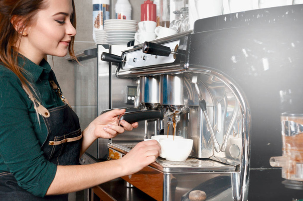 woman making coffee by coffee machine in coffee shop cafe - Zdjęcie, obraz
