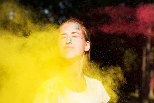 Adorable blonde woman in vibrant colors exploding around her at  - Photo, Image