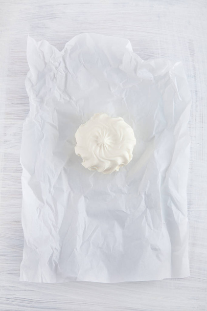 fresh cream cheese on white paper and white wood table can be used as background - Foto, Imagem