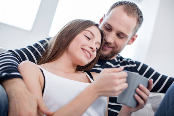 Delighted woman and man enjoying their day off together - Photo, image