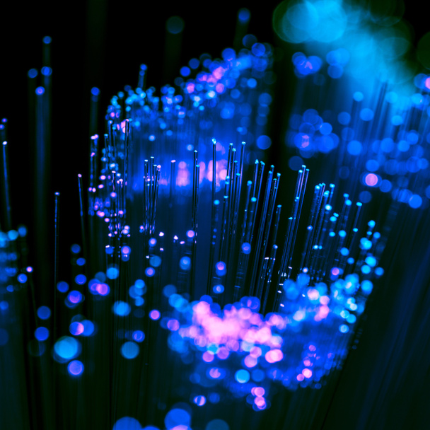 selective focus of shiny blue and purple fiber optics background, communication technology - Photo, Image