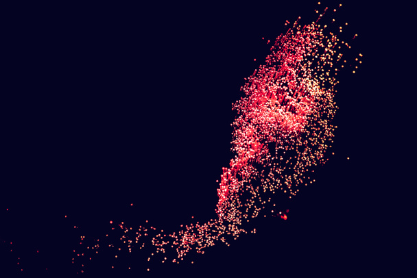 kiiltävä punainen kuituoptiikka tummalla pohjalla, näyttää tähdistöltä avaruudessa
 - Valokuva, kuva