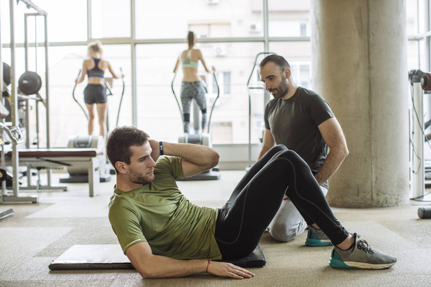 Man Doing Crunches at Gym - Photo, image