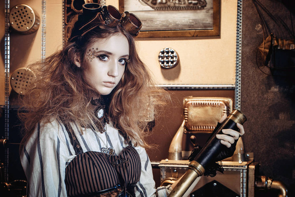 Portrait of a beautiful steampunk woman, with a telescope on a g - Foto, immagini