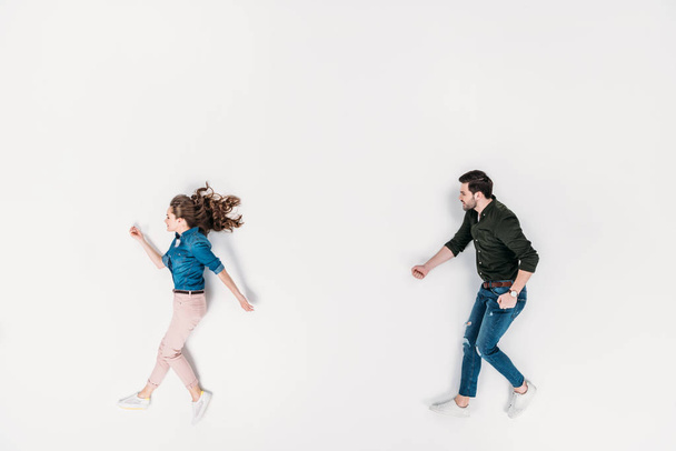 top view of man and woman pretending to walk isolated on white - Фото, зображення