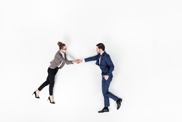 top view of business partners shaking hands isolated on white - Photo, Image