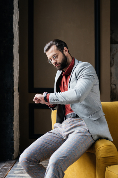 handsome stylish elegant man looking at watch - Fotoğraf, Görsel