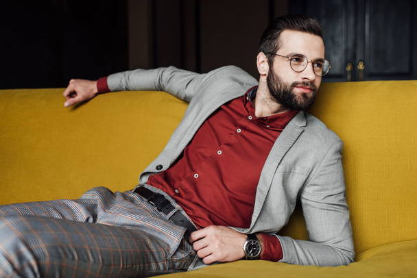 bearded elegant man relaxing on couch - Photo, Image