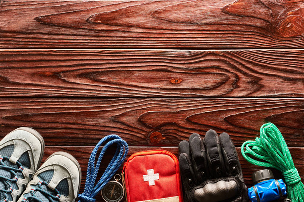 Travel items for hiking tourism on wooden background with copy space - Photo, Image