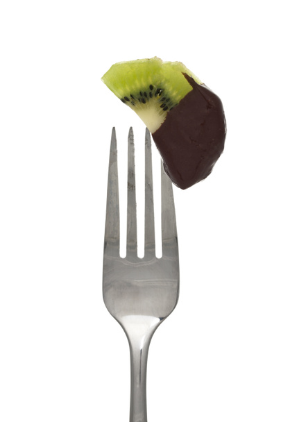 vork met kiwi en chocolade - Foto, afbeelding
