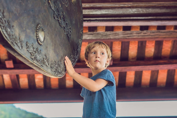 Boy tourist in Pagoda. Travel to Asia concept. Traveling with a baby concept. - 写真・画像