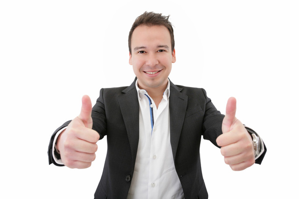 Smiling young business man thumbs up, isolated on white. Focus o - Photo, Image