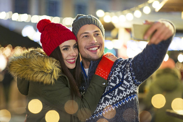 Young Couple Having Fun Outdoors At Christmas Time - Foto, Imagem
