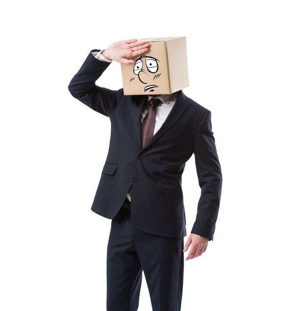 tired businessman with cardboard box on head, isolated on white - Photo, Image
