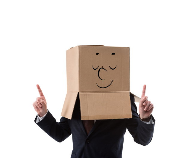 nyugodt üzletember, a fejét felfelé mutató ujjával elszigetelt fehér karton doboz - Fotó, kép