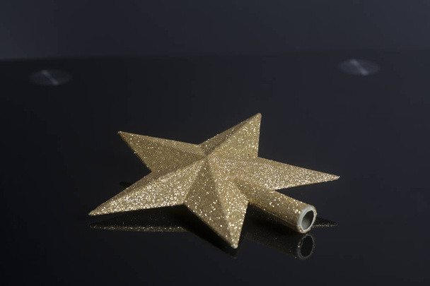 Golden Christmas Star isolated on black background - Photo, Image