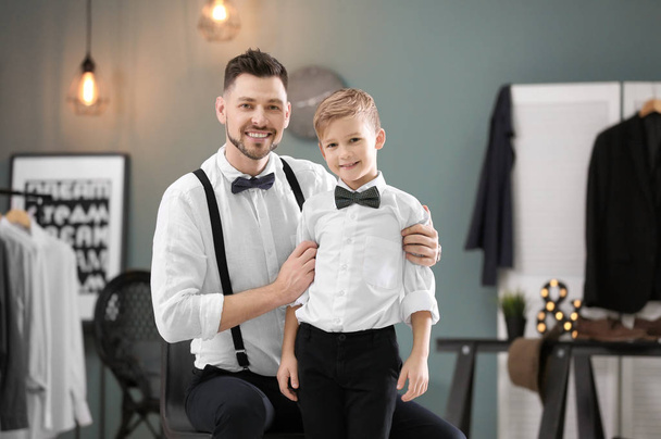 Father and son in elegant suits, indoors - Foto, Imagem
