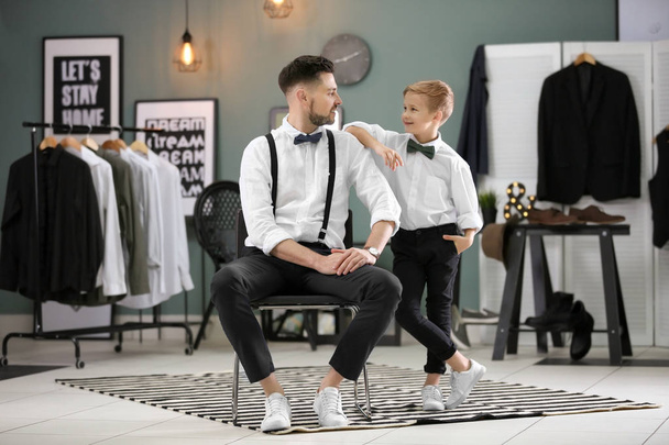 Father and son in elegant suits, indoors - Foto, Bild