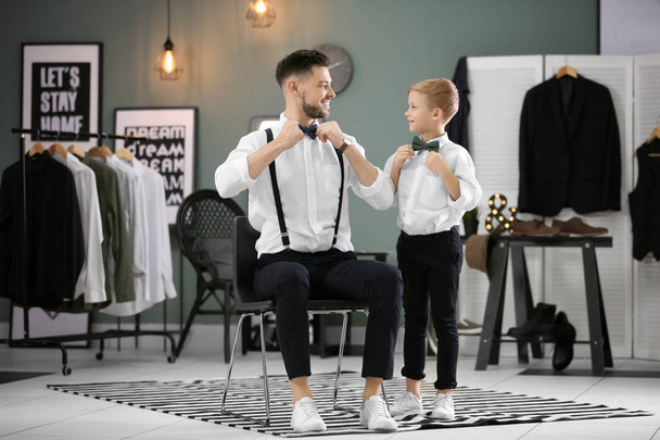 Father and son in elegant suits, indoors - Foto, Imagem
