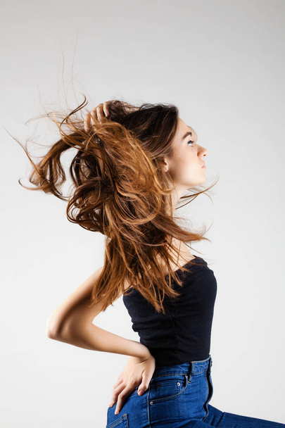 beautiful brunette girl with windy hair - Foto, afbeelding