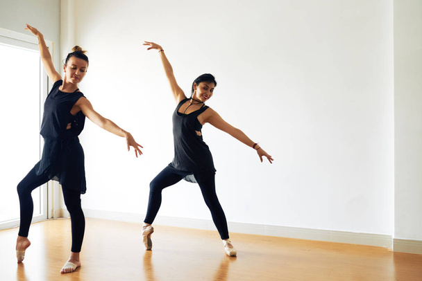 women practicing and dancing ballet in studio room - Fotó, kép