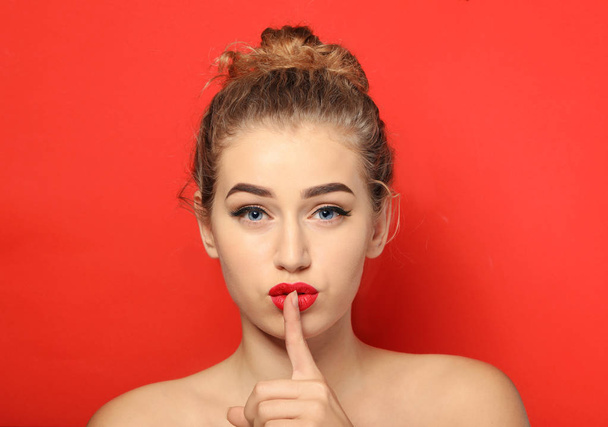 Portrait of young woman with beautiful eyebrows on color background - Photo, Image