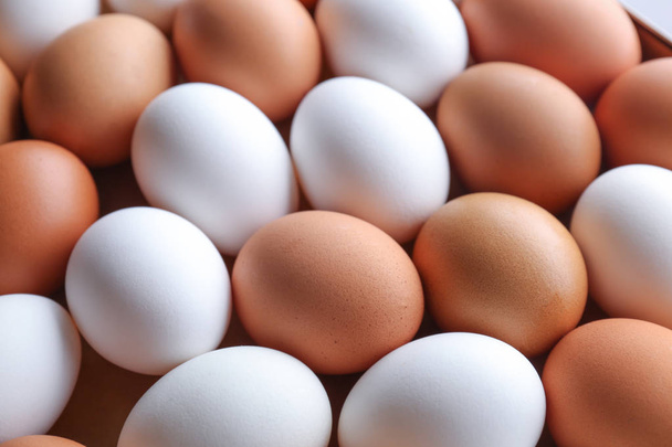 Raw chicken eggs as background - Photo, image