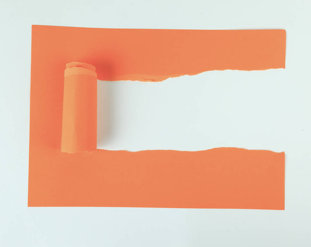 background .orange torn paper on white cardstock - Фото, изображение