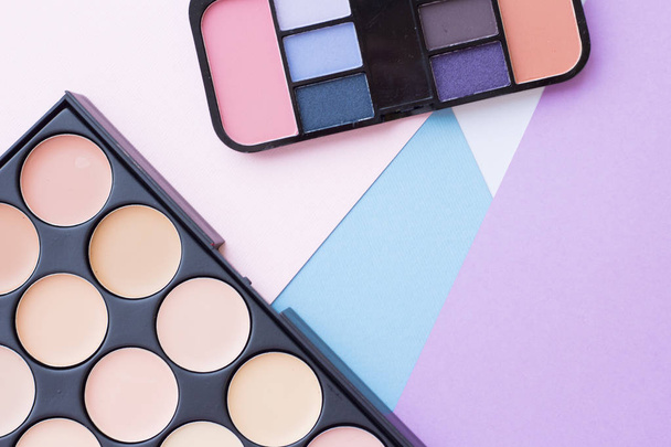 Cosmetic products on pastel colors background - Valokuva, kuva