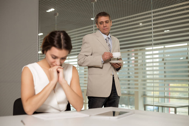 a man and a woman work in an office and talking - 写真・画像