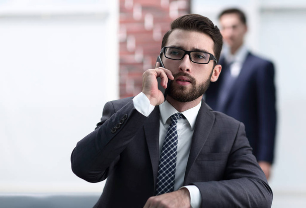 View of a Young attractive business man using smartphone - Foto, Imagem