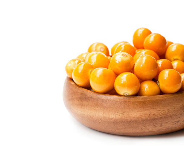ripe  physalis in wooden bowl on white background  - Foto, Imagen